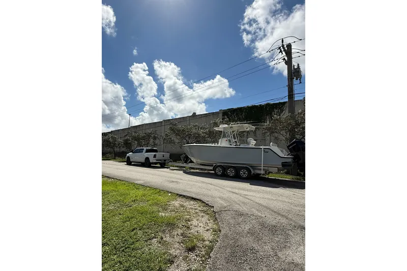 Slide: The Image of 2020 SeaVee 290B boat dashboard with dual Garmin navigation screens and controls. - 8