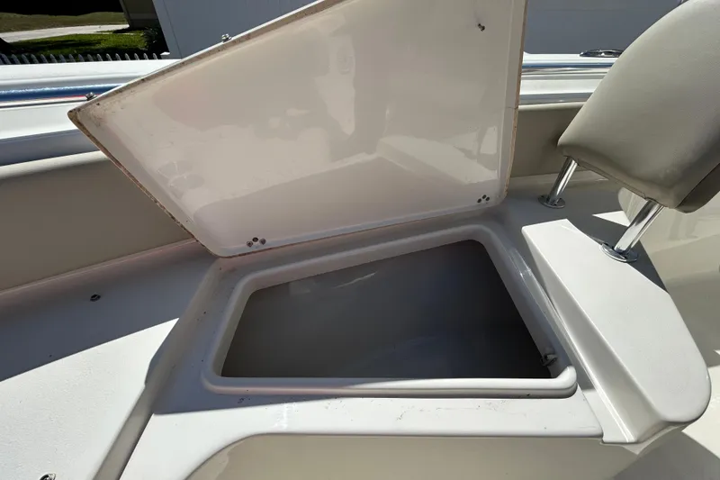 Slide: The Image of Open storage compartment on a 2022 Key West 219 FS boat. - 105
