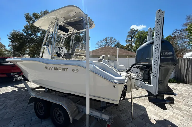 Slide: The Image of 2022 Key West 219 FS boat on trailer with Yamaha outboard motor. - 13