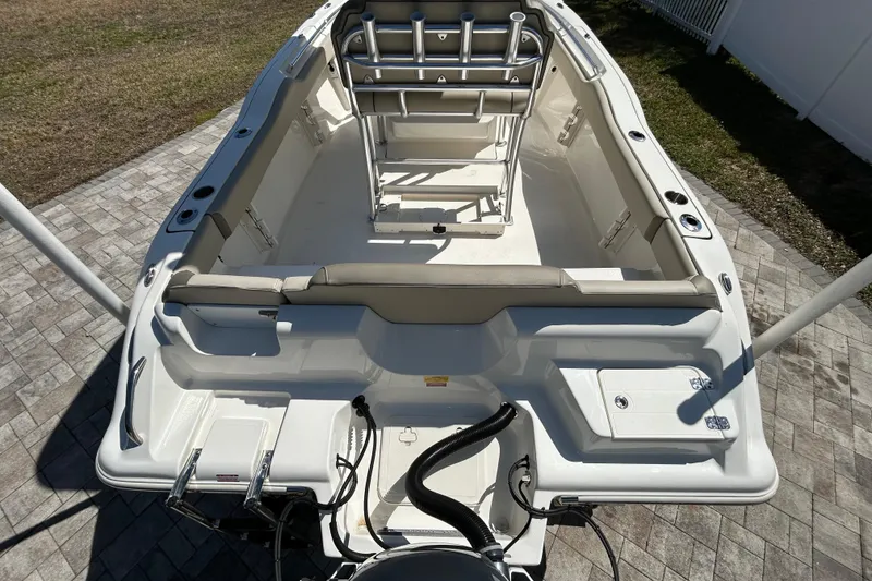 Slide: The Image of 2022 Key West 219 FS boat interior with seating and storage compartments. - 19