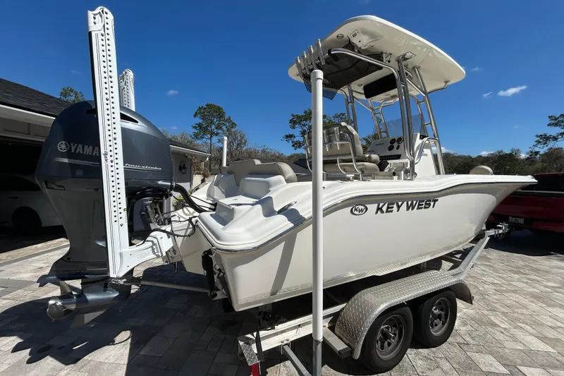 Slide: The Image of 2022 Key West 219 FS boat on trailer with Yamaha outboard motor. - 2