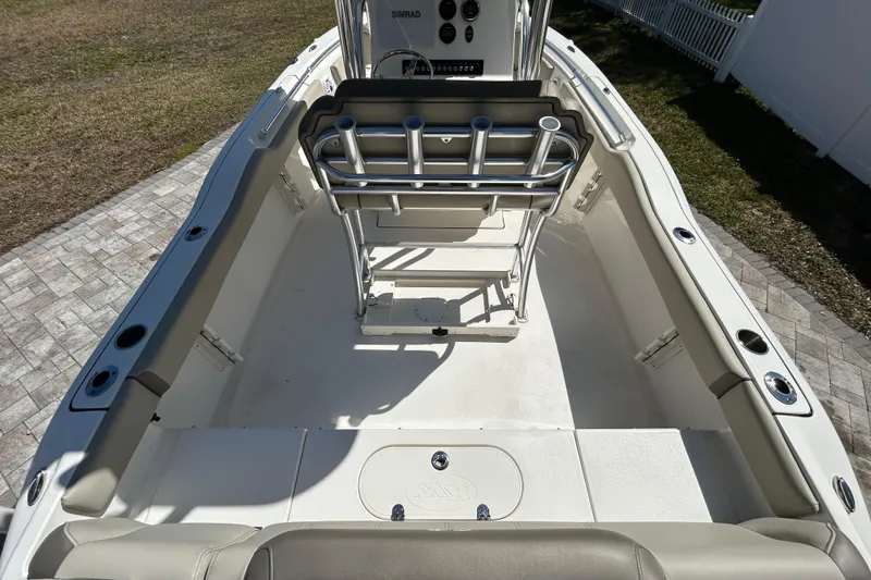 Slide: The Image of 2022 Key West 219 FS boat interior with seating and rod holders. - 21