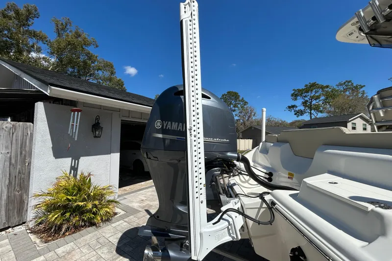 Slide: The Image of 2022 Key West 219 FS boat with Yamaha engine in driveway, sunny day. - 3
