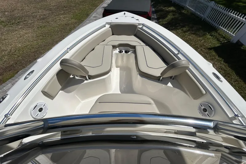 Slide: The Image of 2022 Key West 219 FS boat interior with beige seating and stainless steel railings. - 31