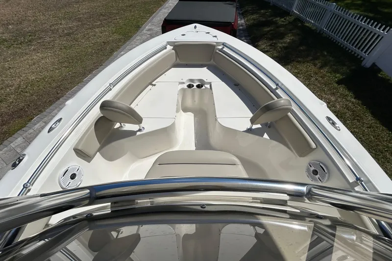 Slide: The Image of 2022 Key West 219 FS boat interior with seating and cup holders. - 32