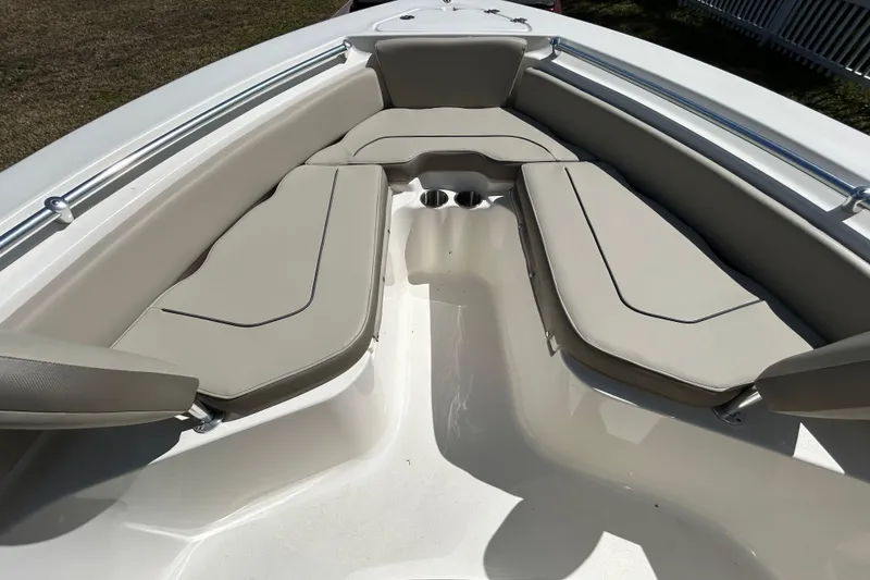 Slide: The Image of 2022 Key West 219 FS boat interior with cushioned seating and cup holders. - 33