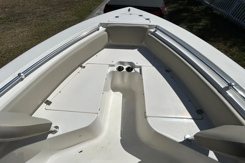 Slide: The Image of 2022 Key West 219 FS boat interior with seating and storage compartments. - 34
