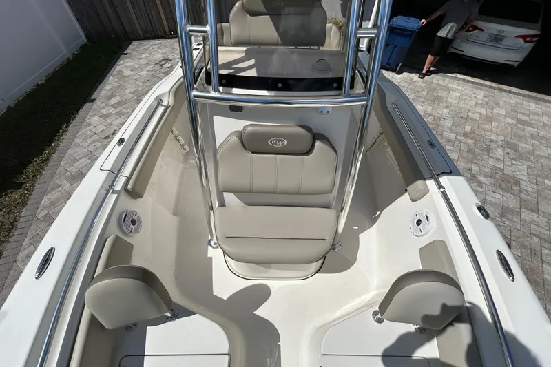 Slide: The Image of 2022 Key West 219 FS boat interior with beige seating and stainless steel accents. - 41