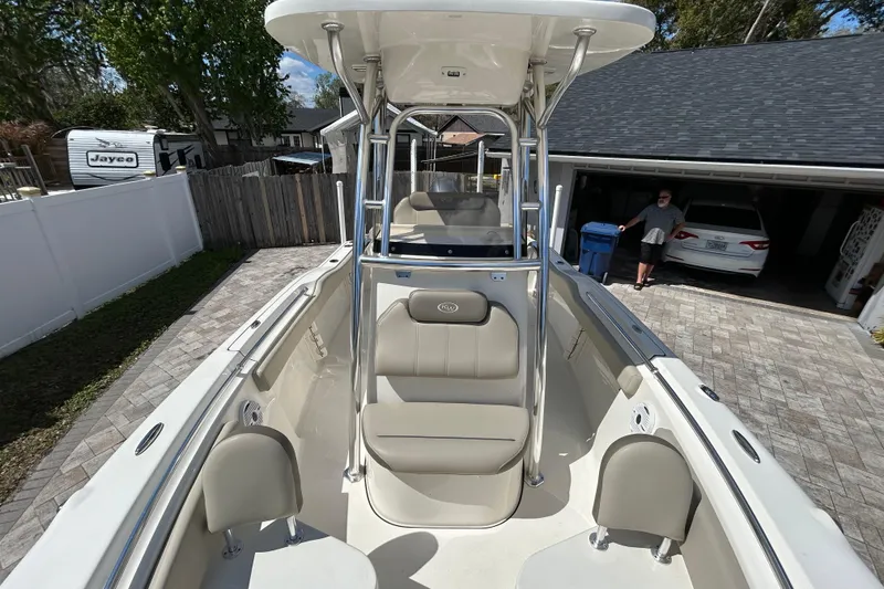 Slide: The Image of 2022 Key West 219 FS boat in driveway, featuring spacious seating and sleek design. - 42