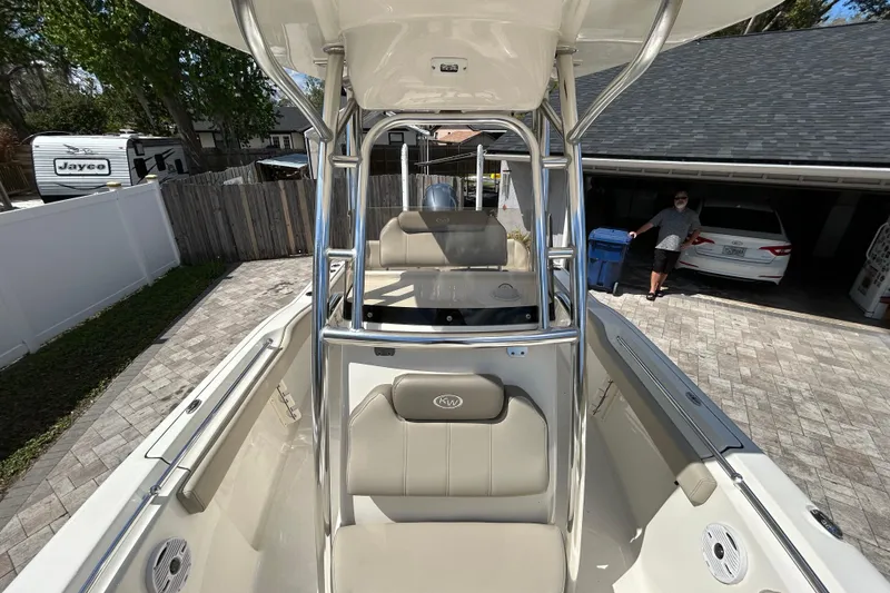 Slide: The Image of 2022 Key West 219 FS boat parked in driveway, featuring sleek design and comfortable seating. - 43