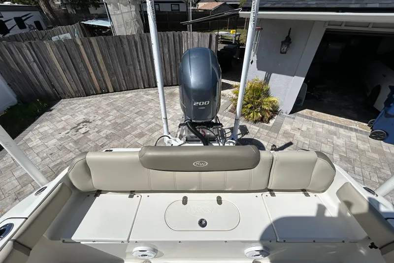 Slide: The Image of 2022 Key West 219 FS boat with Yamaha 200 engine, parked in driveway. - 53