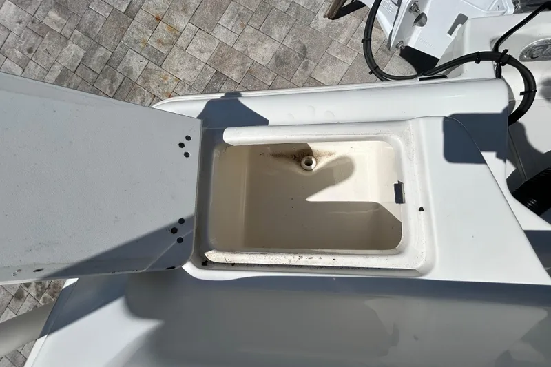 Slide: The Image of Open storage compartment on 2022 Key West 219 FS boat, showing interior details. - 59