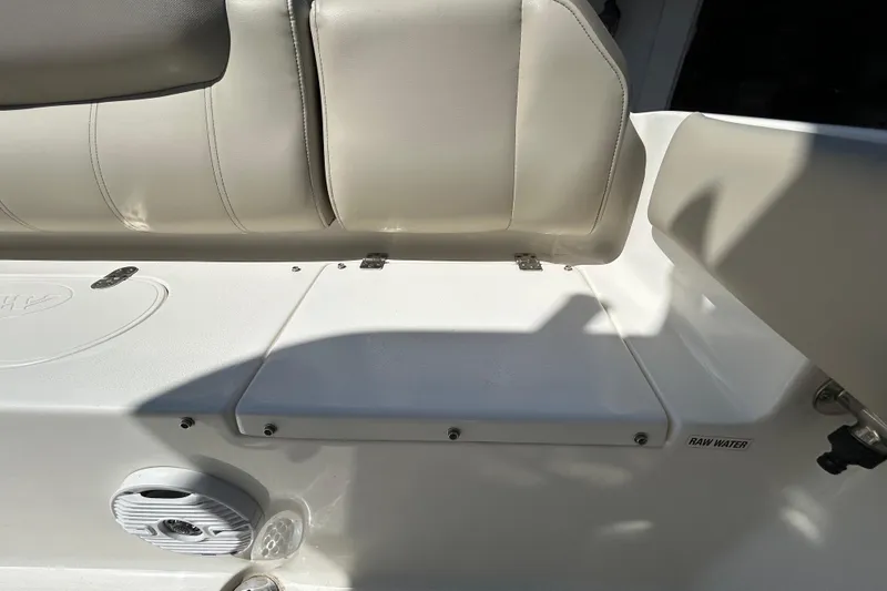 Slide: The Image of 2022 Key West 219 FS boat interior with cushioned seating and speaker. - 69