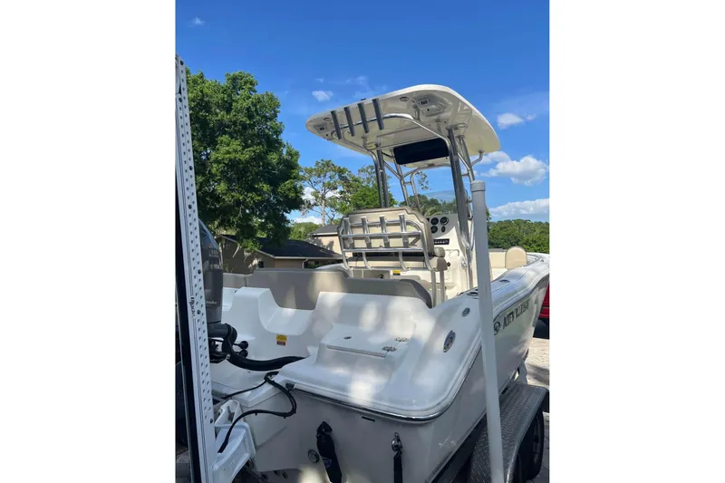 Slide: The Image of 2022 Key West 219 FS boat on trailer, sunny day, blue sky background. - 7