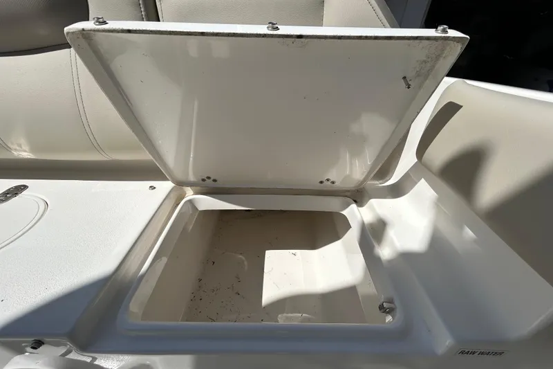 Slide: The Image of Open storage compartment on 2022 Key West 219 FS boat, showing interior details. - 70