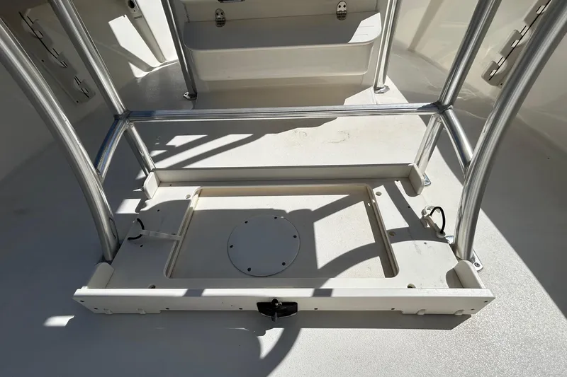 Slide: The Image of 2022 Key West 219 FS boat interior with stainless steel frame and storage compartment. - 74