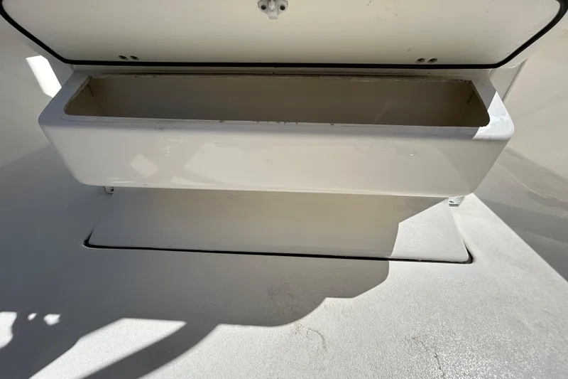 Slide: The Image of Open storage compartment on 2022 Key West 219 FS boat, showcasing interior space. - 76