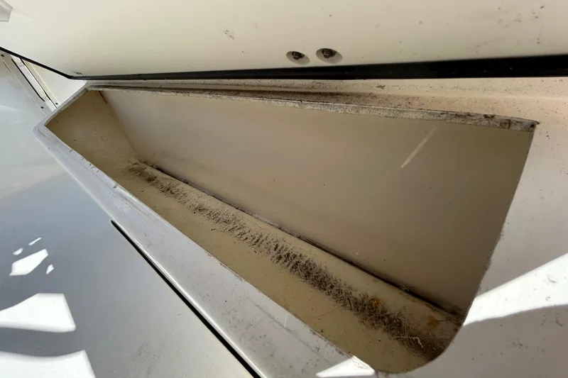 Slide: The Image of Storage compartment of 2022 Key West 219 FS boat, showing interior details. - 77