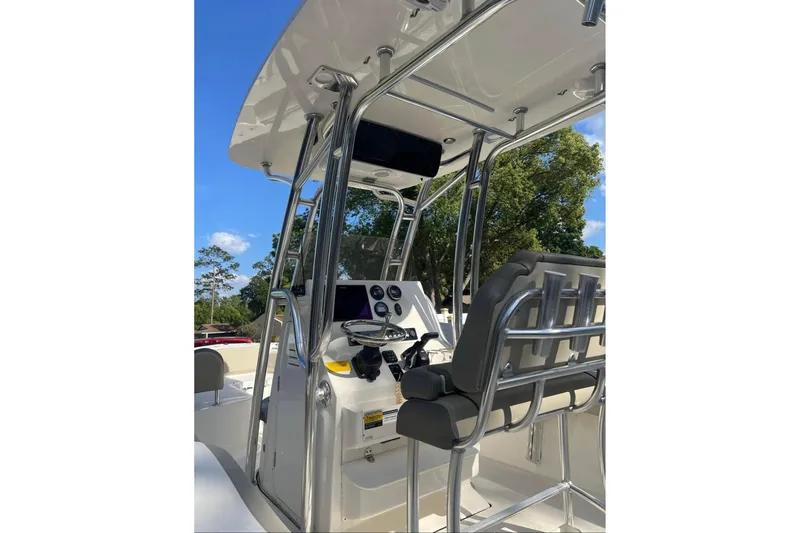 Slide: The Image of 2022 Key West 219 FS boat console with seating and navigation equipment. - 8