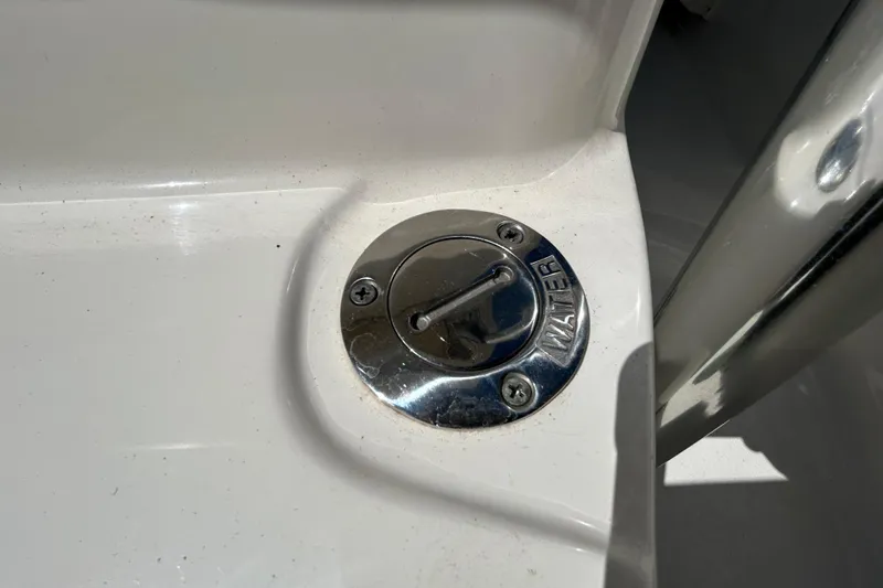 Slide: The Image of Water fill cap on 2022 Key West 219 FS boat, stainless steel finish. - 92