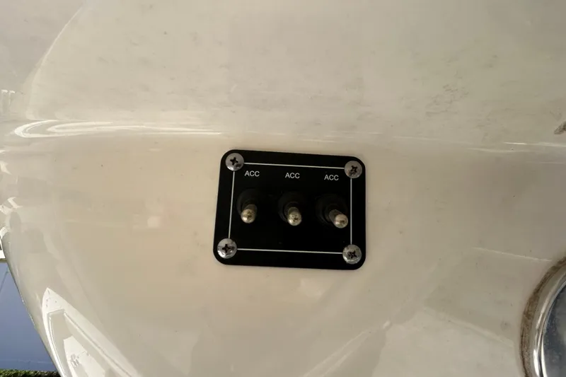 Slide: The Image of 2022 Key West 219 FS boat accessory switches on white panel. - 93