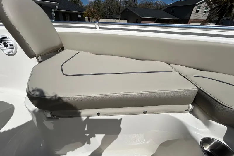 Slide: The Image of 2022 Key West 219 FS boat seat with beige upholstery and sleek design. - 96