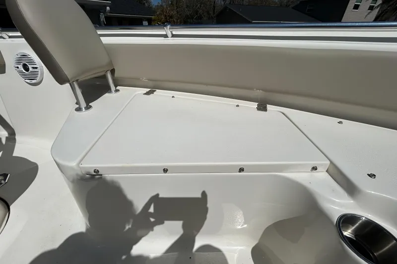 Slide: The Image of 2022 Key West 219 FS boat interior with seating and storage compartment. - 97