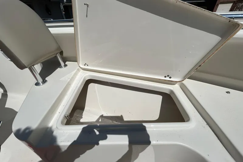 Slide: The Image of Open storage compartment on 2022 Key West 219 FS boat, showcasing interior space. - 98
