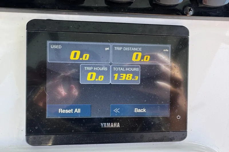 Slide: The Image of Yamaha display on 2023 Sea Hunt Ultra 239 SE showing trip data and total hours. - 14