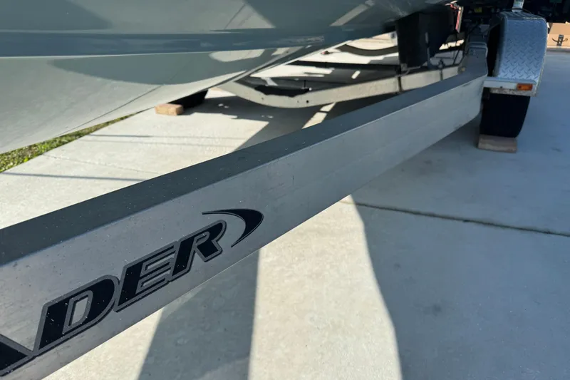 Slide: The Image of 2023 Sea Hunt Ultra 239 SE boat on trailer, close-up view. - 21