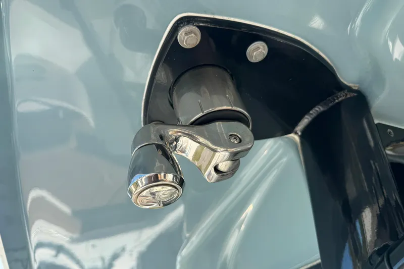 Slide: The Image of Close-up of a 2023 Sea Hunt Ultra 239 SE boat component, featuring a chrome fitting. - 27