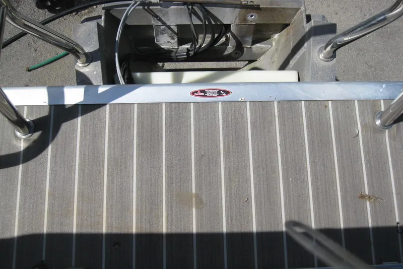 Slide: The Image of Rear deck of 2016 Harris FloteBote 200 Cruiser CX pontoon boat with metal railing. - 17