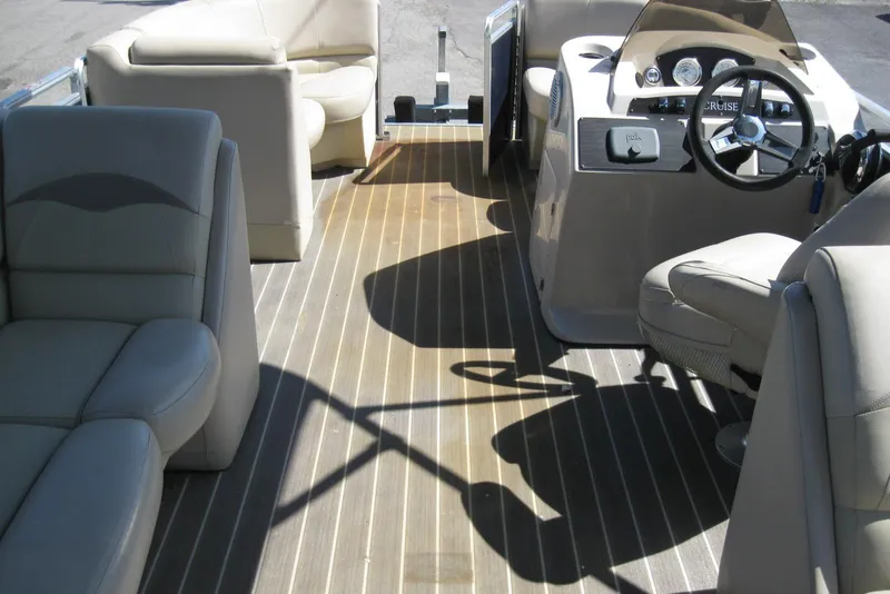 Slide: The Image of Interior of 2016 Harris FloteBote 200 Cruiser CX pontoon boat with beige seating. - 18