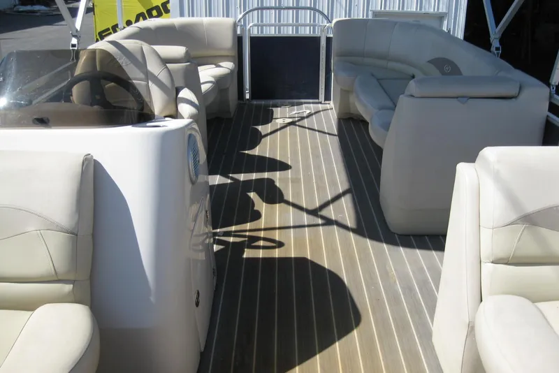 Slide: The Image of 2016 Harris FloteBote 200 Cruiser CX interior with beige seating and wood-style flooring. - 6