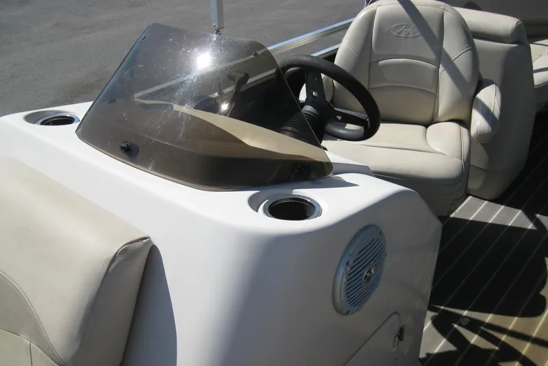 Slide: The Image of 2016 Harris FloteBote 200 Cruiser CX interior with steering wheel and seating. - 9