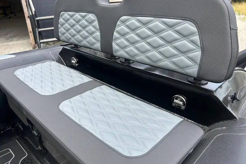 Slide: The Image of 2025 Highfield Sport 390 boat seat with diamond-stitched upholstery, showcasing luxury design. - 9