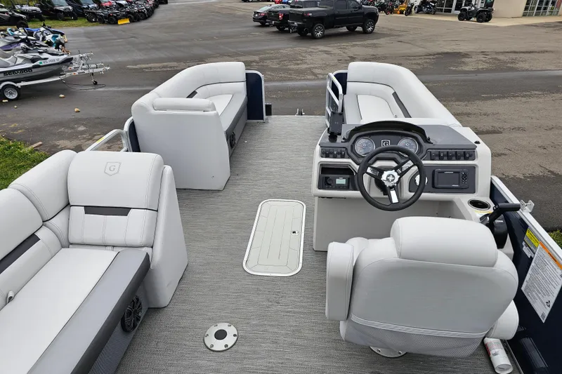 Slide: The Image of 2022 Sweetwater 2286 SFL pontoon boat interior with modern seating and steering console. - 15