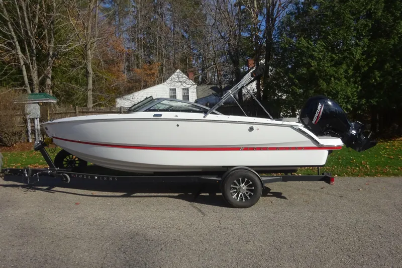 The Image of 2024 Four Winns H1 OB boat on trailer, parked outdoors. - 1
