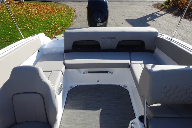 Slide: The Image of 2024 Four Winns H1 OB boat interior with gray seating and spacious layout. - 18