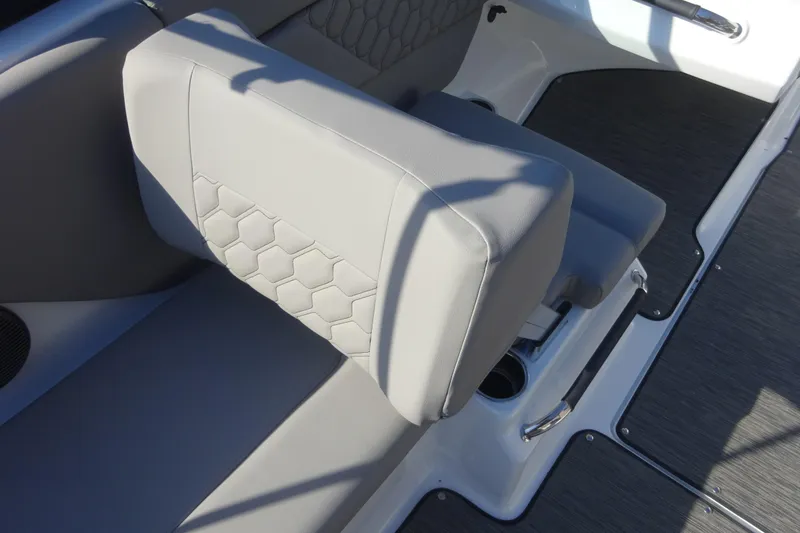 Slide: The Image of 2024 Four Winns H1 OB boat interior with gray seating and hexagonal pattern. - 8