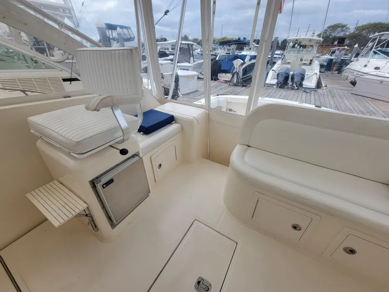 Slide: The Image of 2006 Carolina Classic 32 Express boat interior with seating and storage. - 12