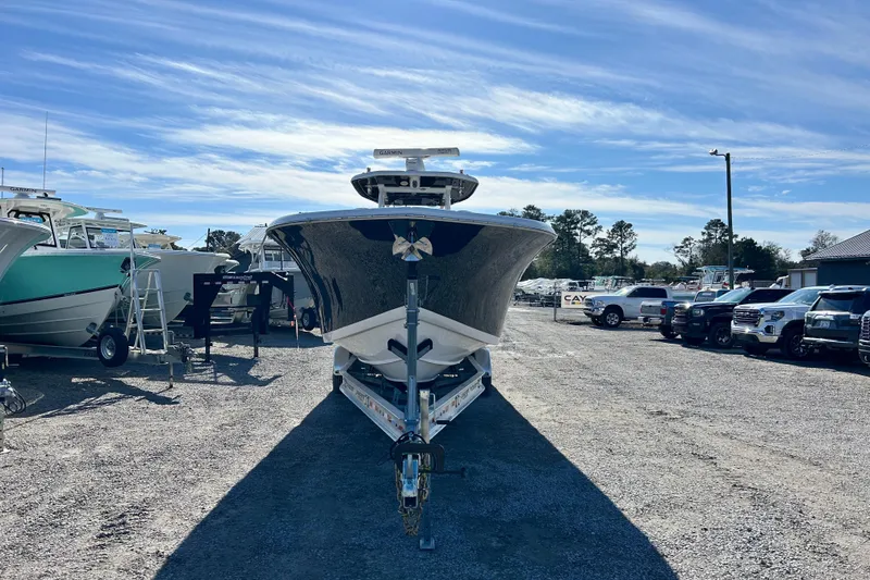 Slide: The Image of 2020 Tidewater 320 CC Adventure boat on trailer in sunny outdoor lot. - 12