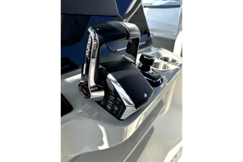 Slide: The Image of 2023 Boston Whaler OUTRAGE boat control panel with sleek design and modern features. - 21