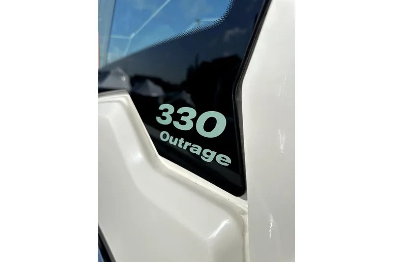 Slide: The Image of 2023 Boston Whaler OUTRAGE 330 boat model detail with sleek design. - 3