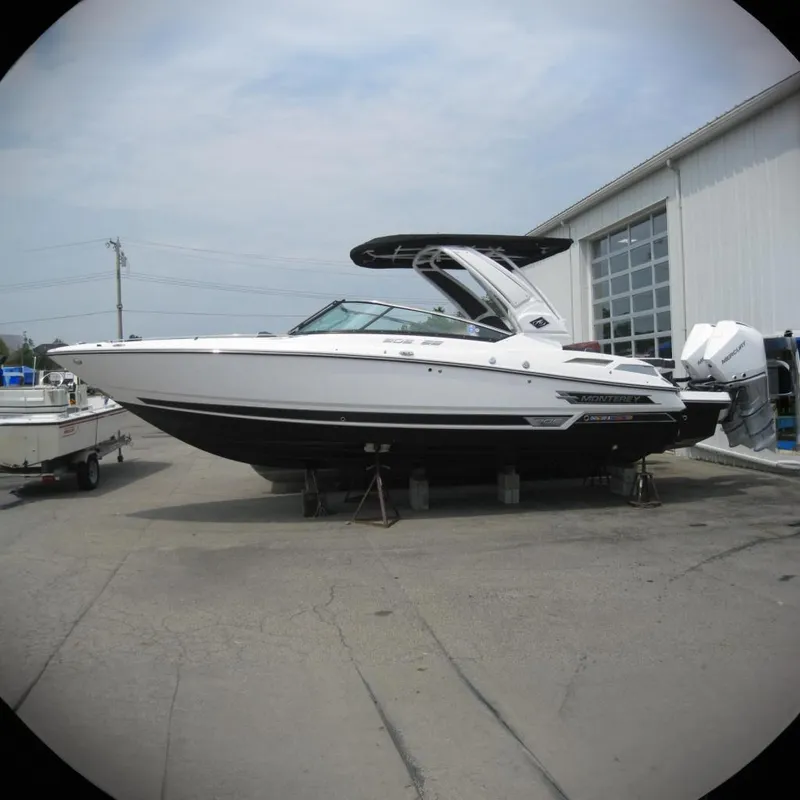 The Image of 2024 Monterey 305SS Super Sport boat on stands, side view, sleek design. - 0