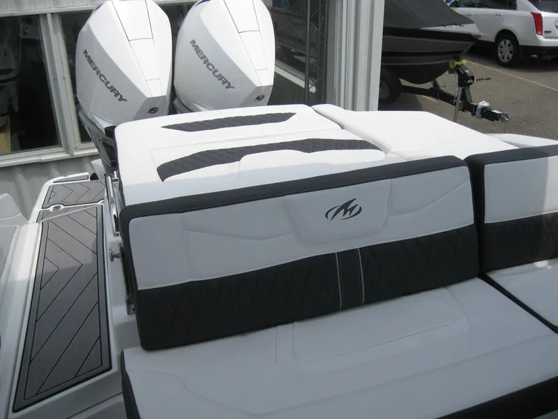 Slide: The Image of 2024 Monterey 305 SS boat with dual Mercury outboard engines. - 10