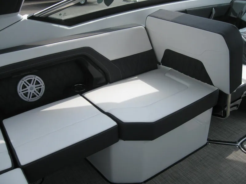 Slide: The Image of 2024 Monterey 305 SS boat interior seating with black and white upholstery. - 11
