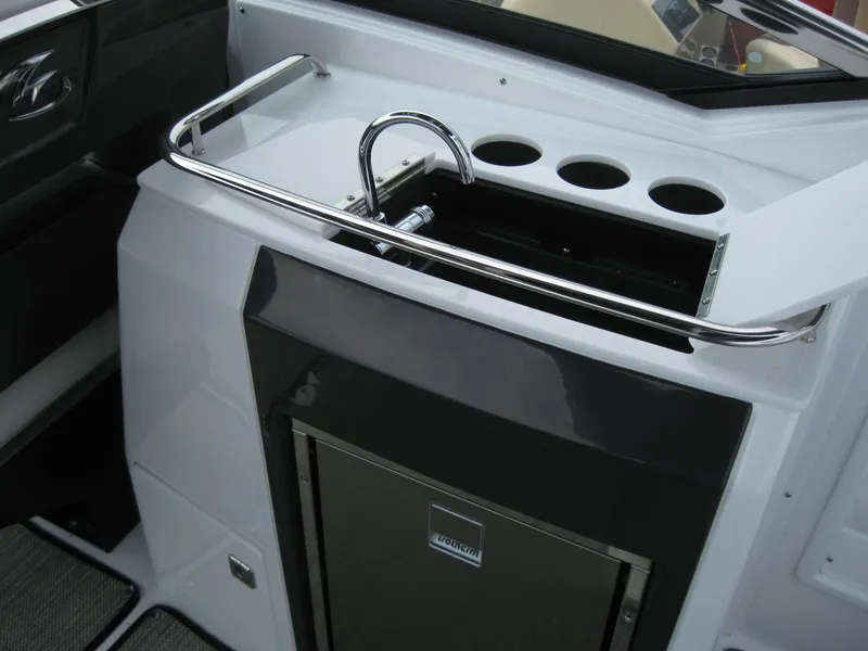 Slide: The Image of 2024 Monterey 305 SS boat interior with sink and storage. - 13