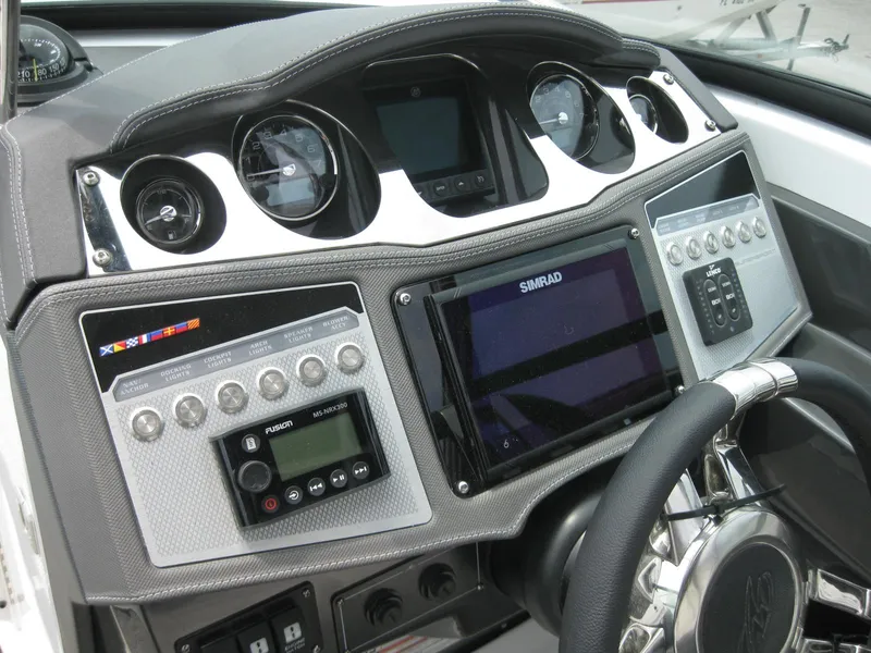 Slide: The Image of 2024 Monterey 305 SS boat dashboard with advanced navigation and control systems. - 16
