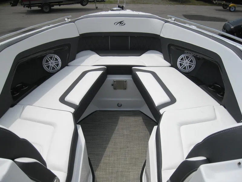 Slide: The Image of 2024 Monterey 305 SS boat interior with white and black seating. - 20